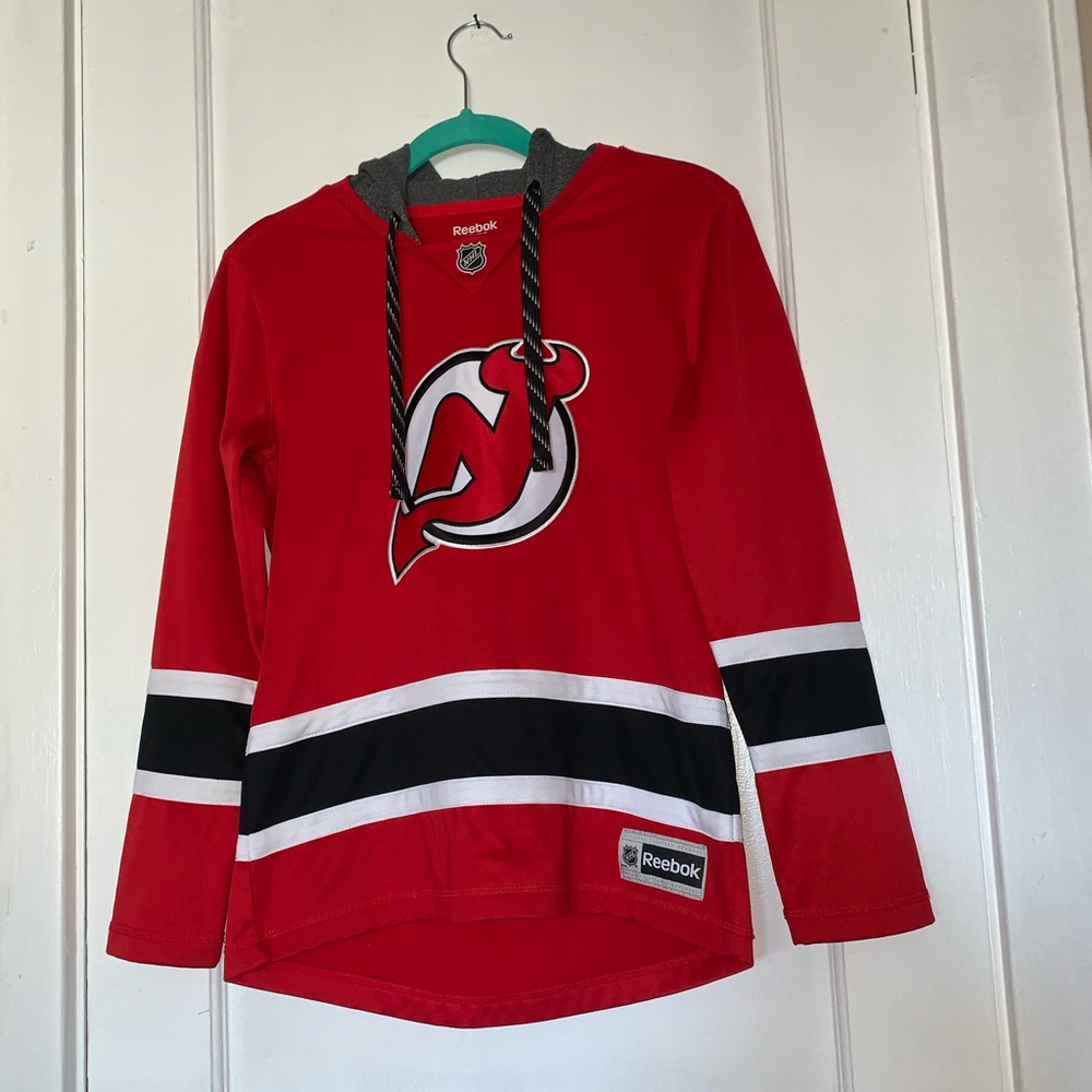 Reebok women’s NJ Devils Jersey hoodie size Small.